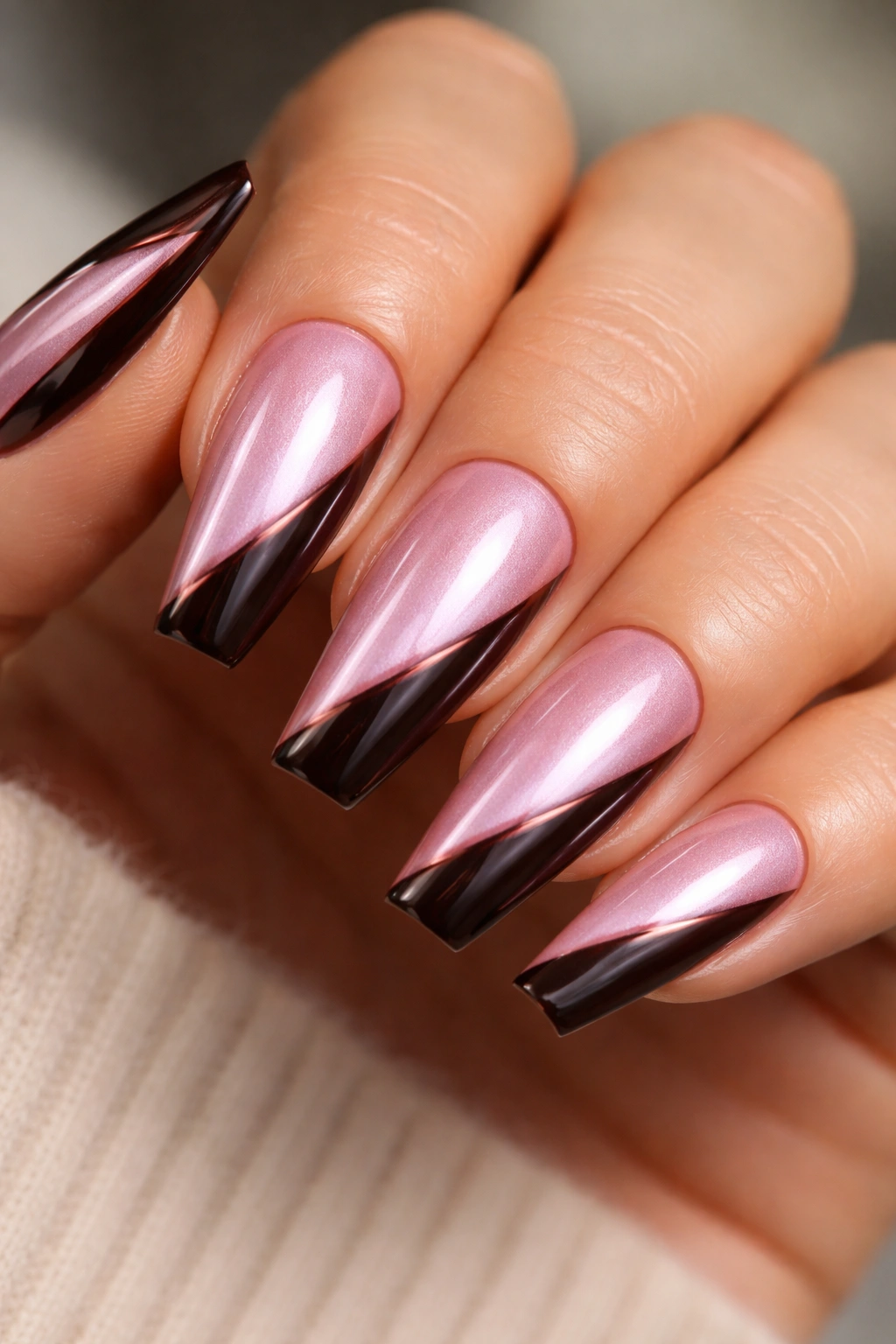 Pink chrome coffin nails with espresso diagonal side-swipe