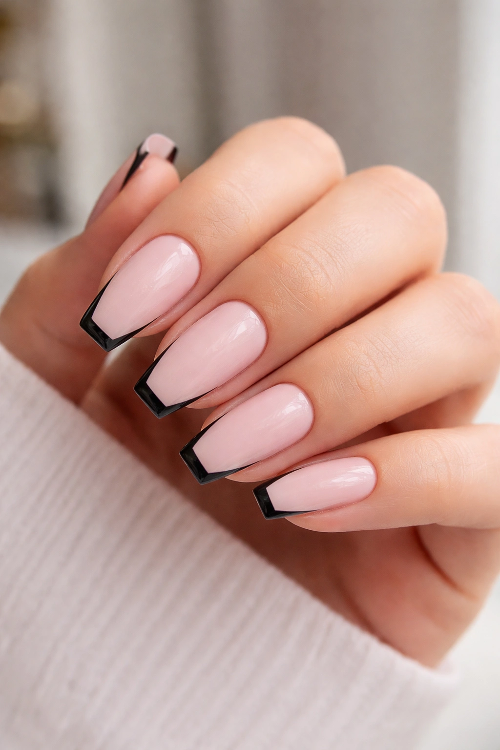 Coffin nails with precise thin black detailing on pink base