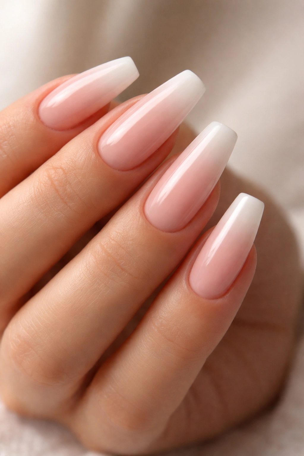 Coffin nails with soft pink base and white French fade