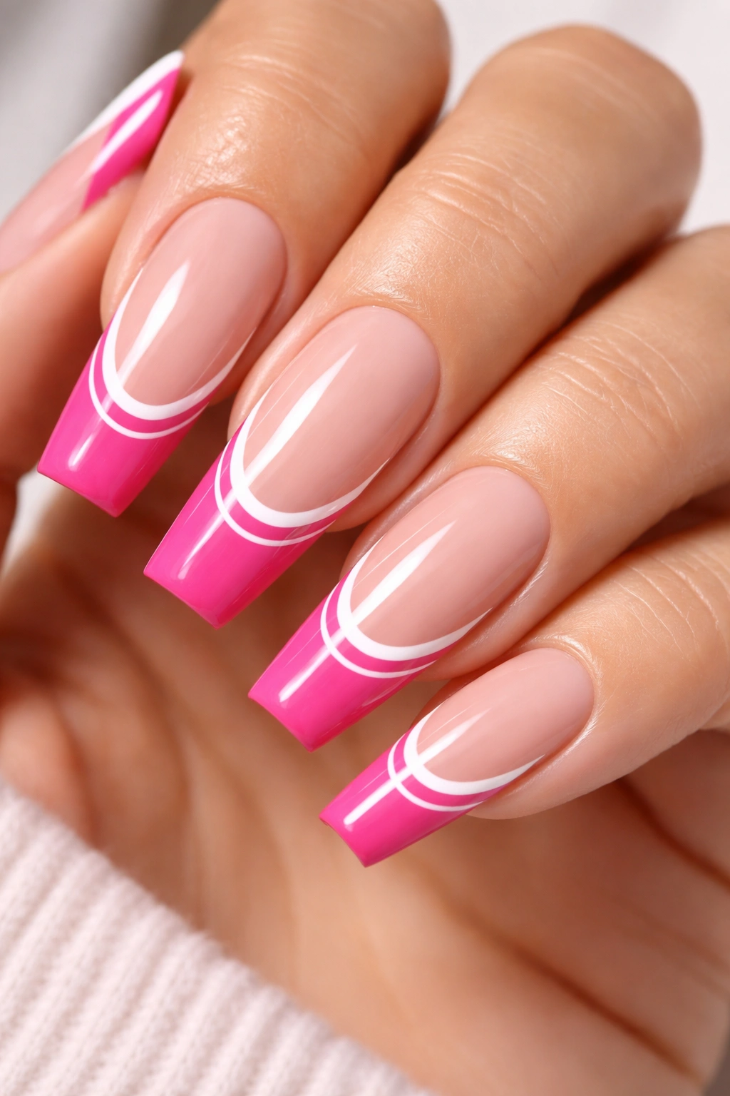 Coffin nails with hot pink tips and a crisp white double line