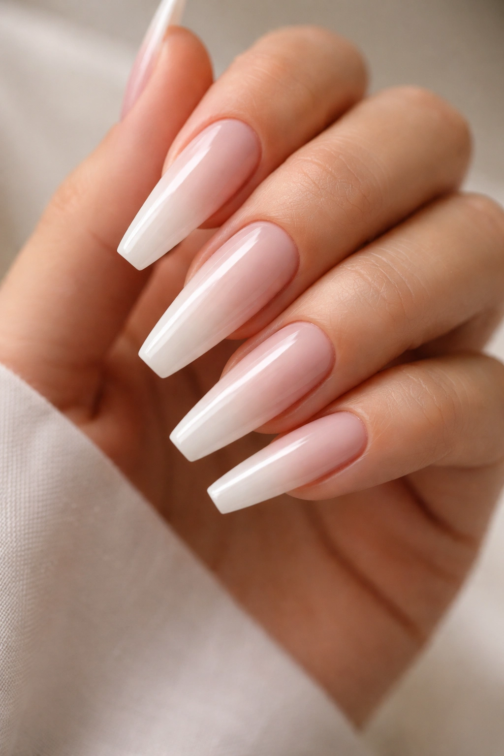 Slim coffin nails with pink-milk base and sheer milky white layer