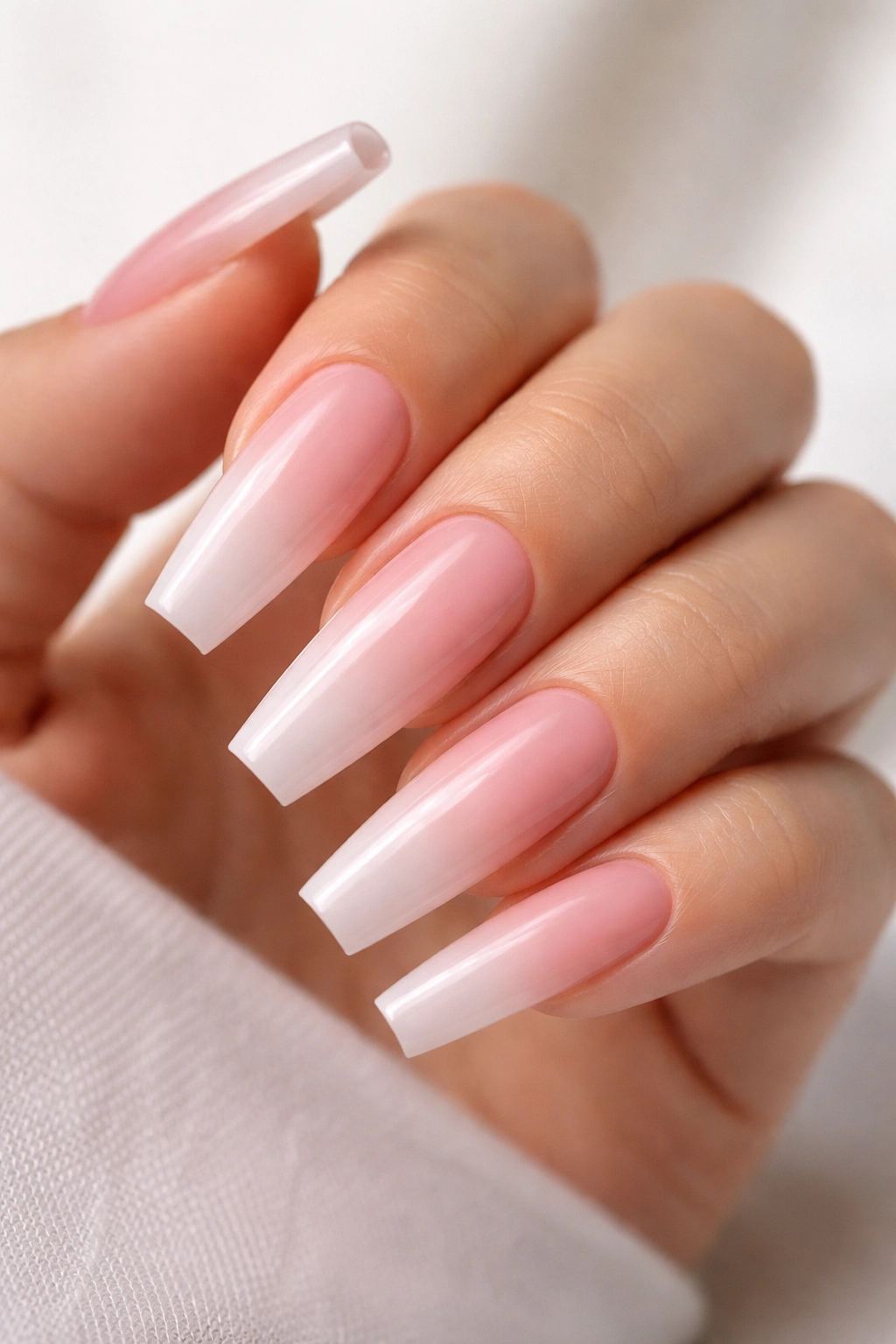 Baby pink ombré coffin nails close-up