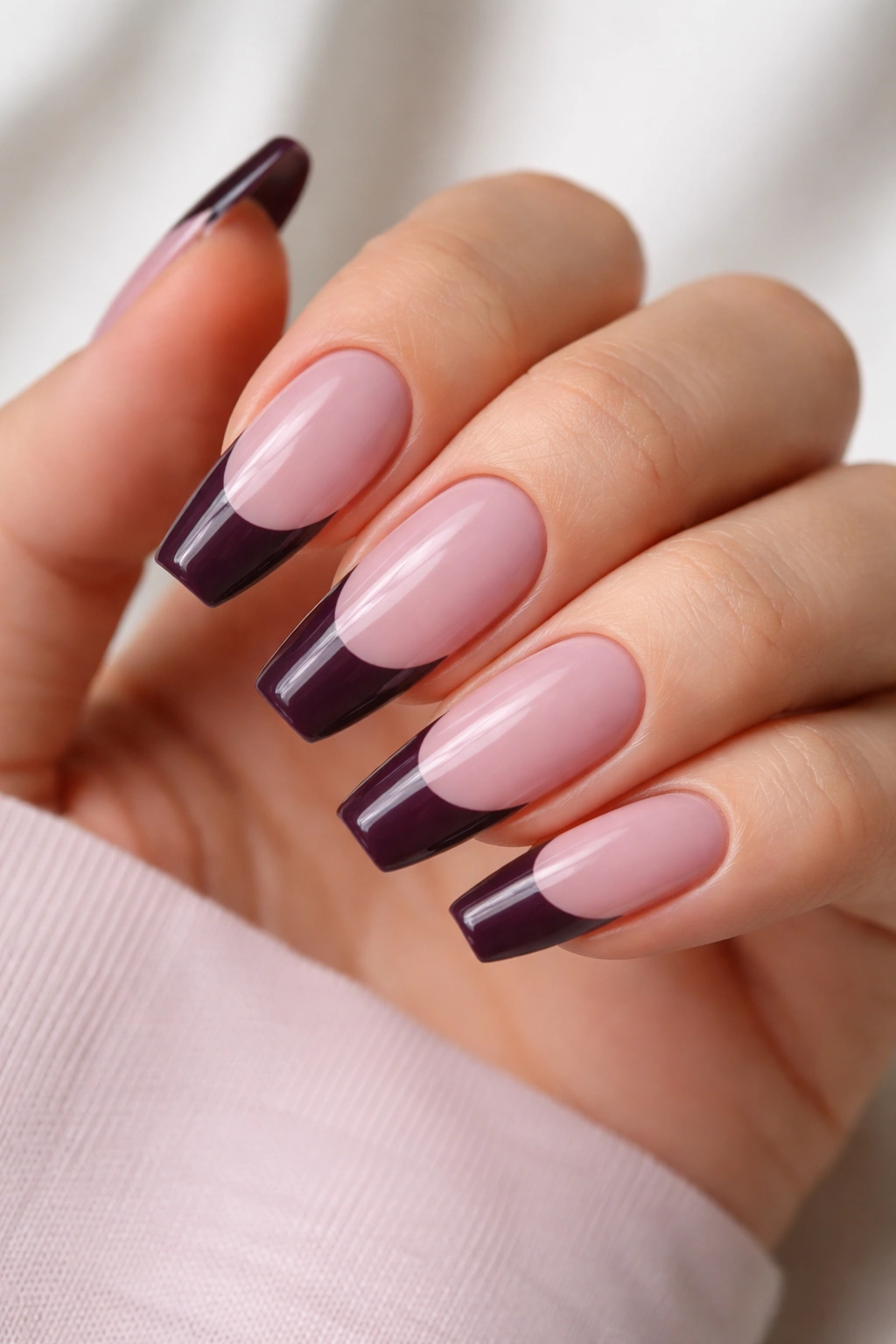 Plum French tips on a sheer mauve base on ballerina nails