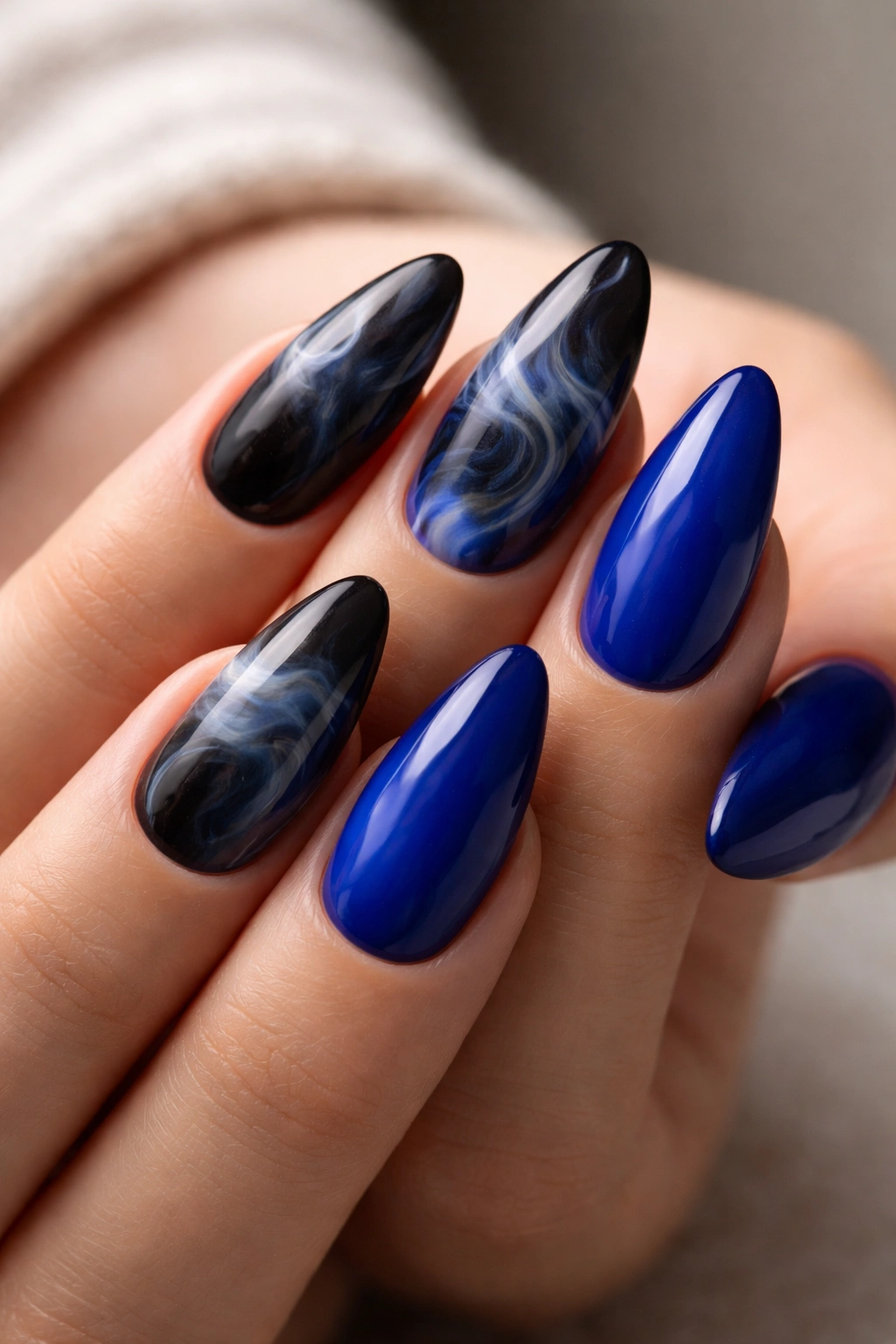 Almond nails with blue and black smoky painterly design