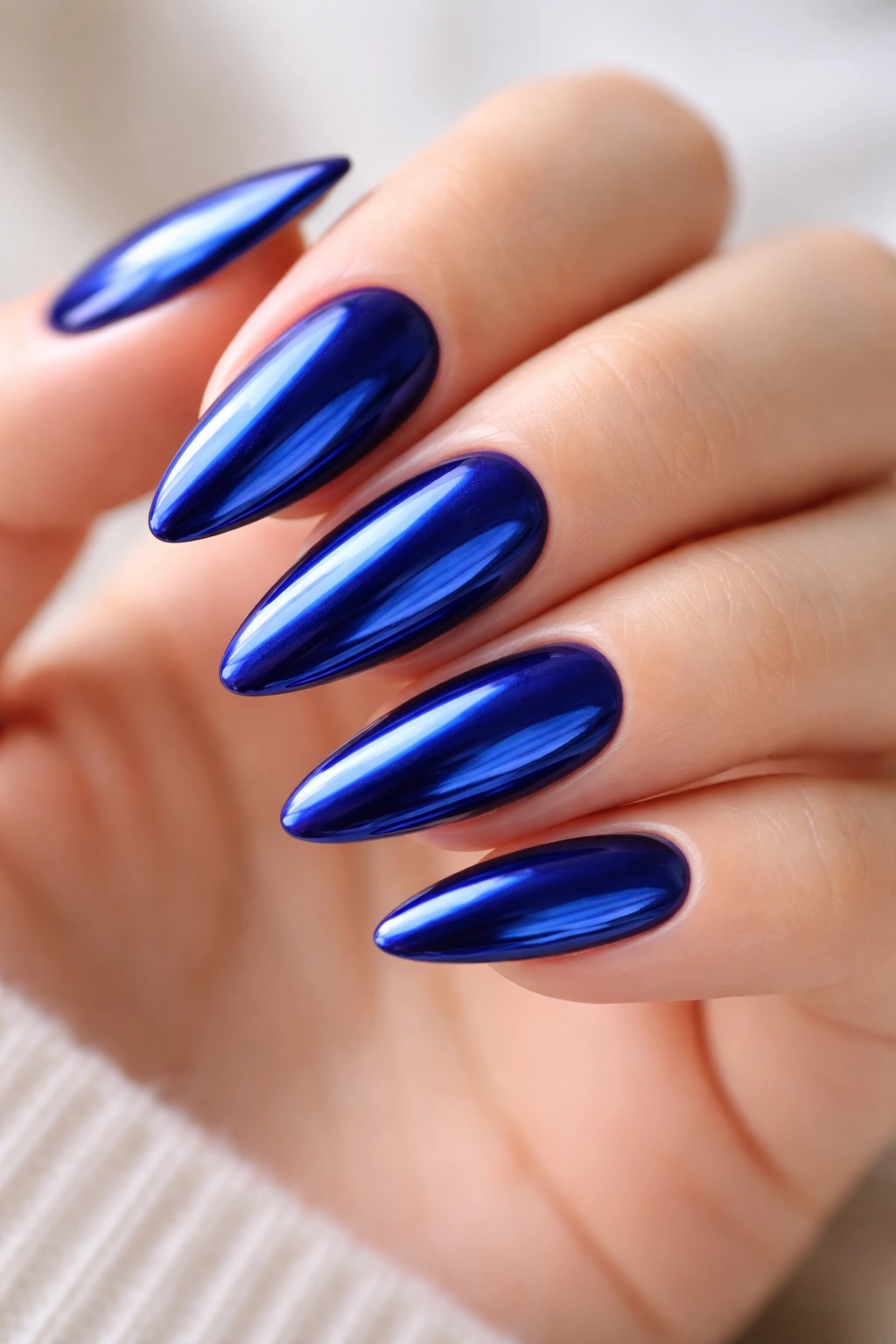 Almond nails with royal blue chrome finish