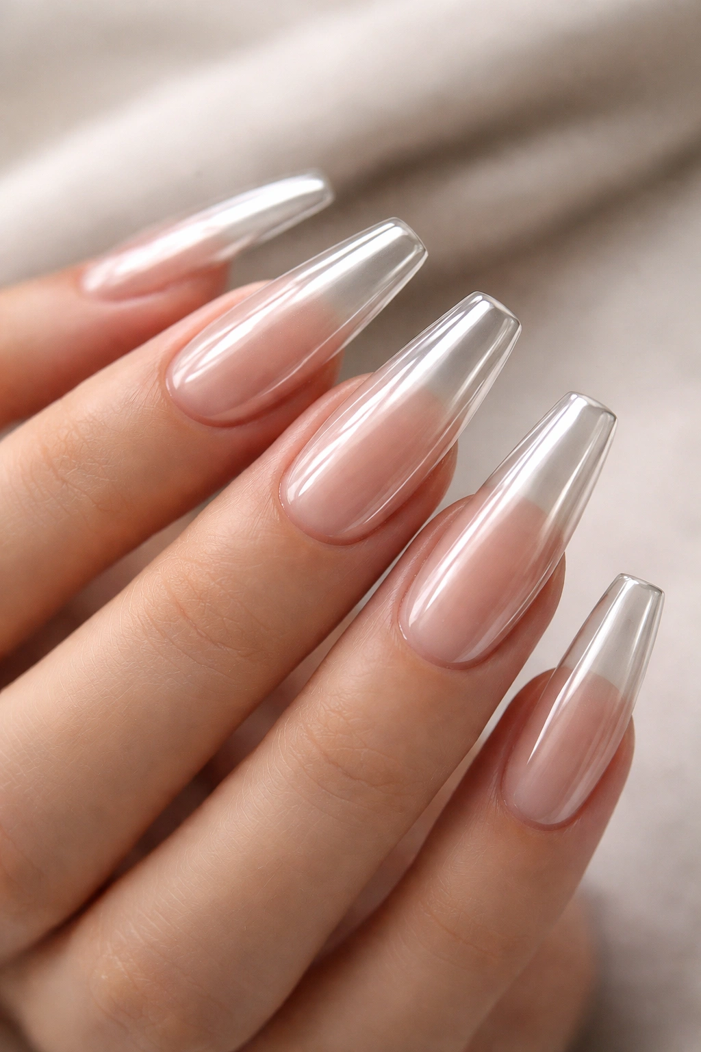 Sheer almond nude glass chrome coffin nails