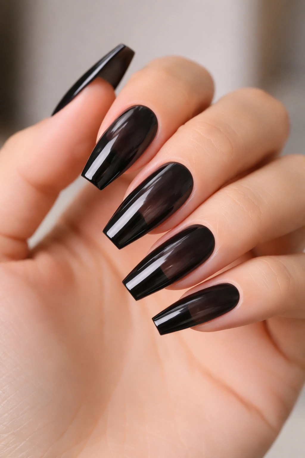 Sheer black jelly coffin nails close-up translucent look