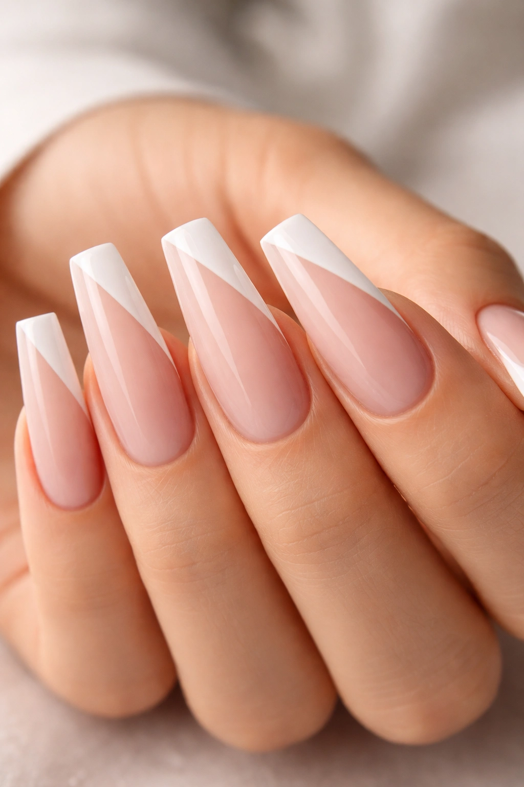 Coffin nails with diagonal French tip on translucent base