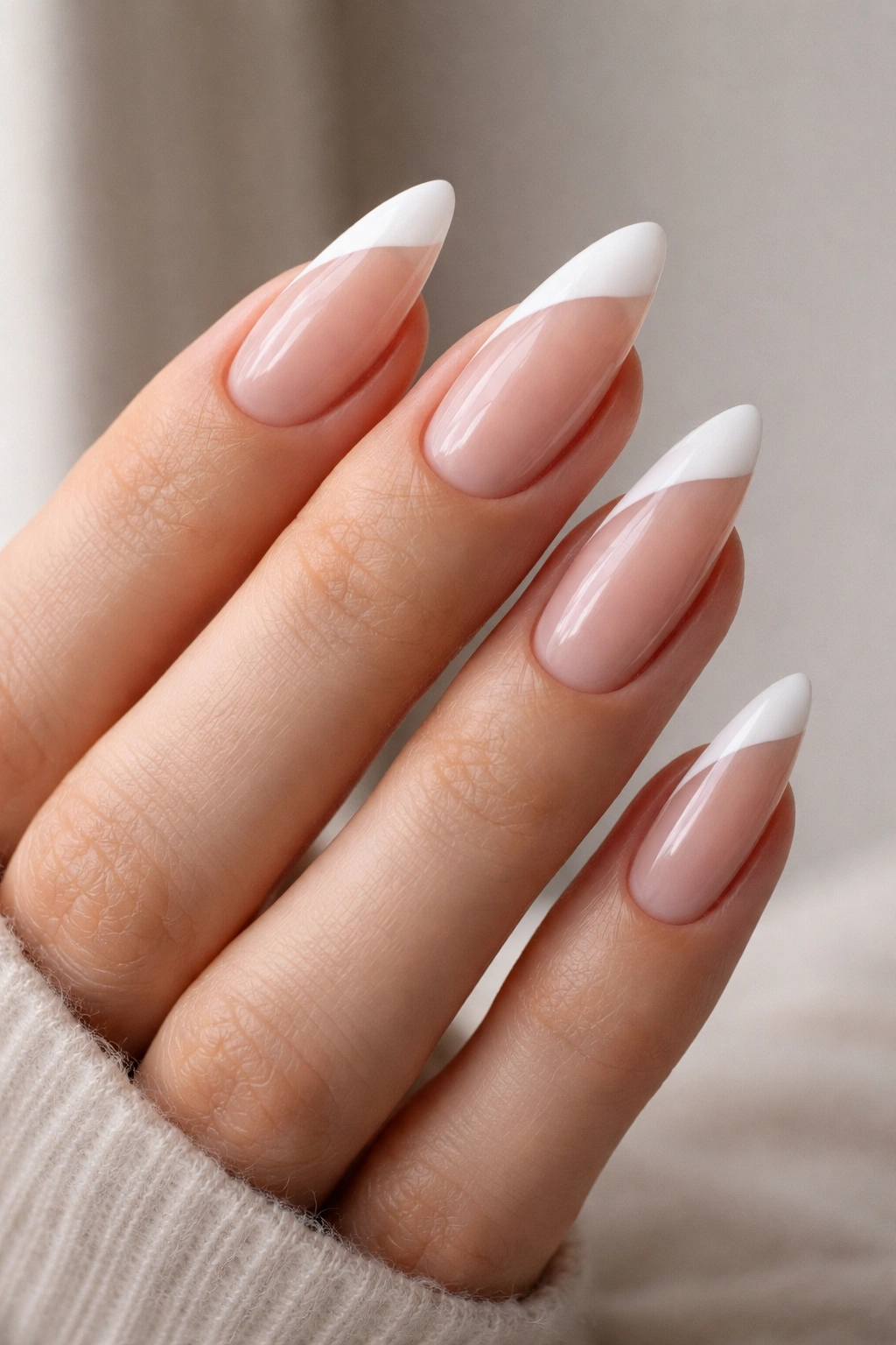 Almond nails with side-swept French tips following the almond curve