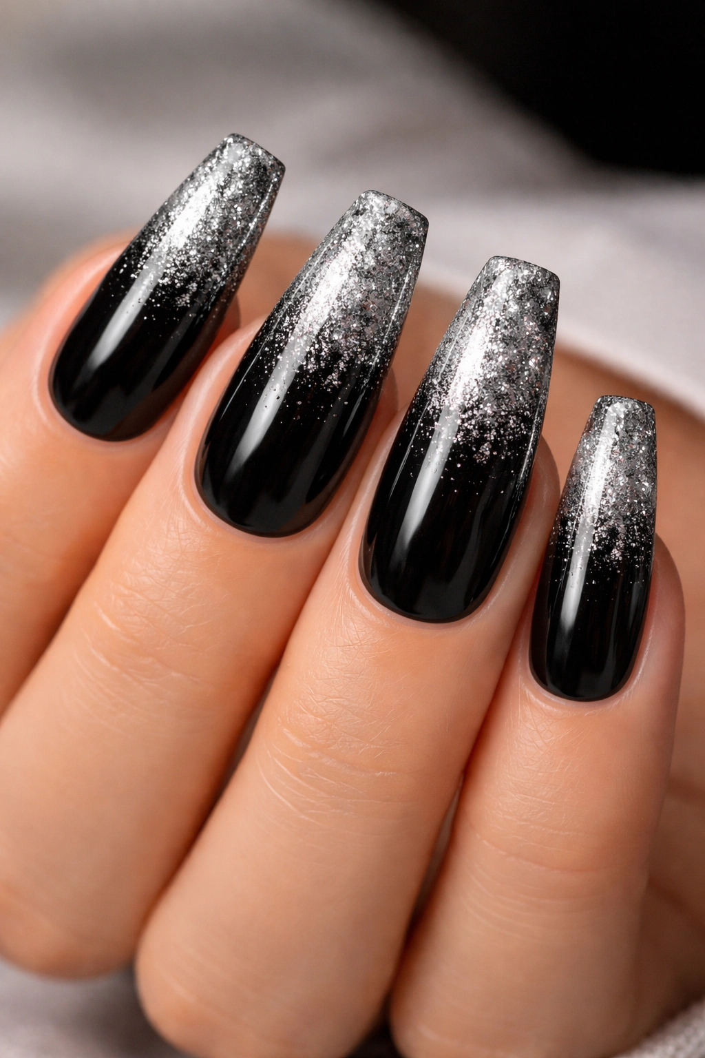 Coffin nails with black base and silver glitter ombre