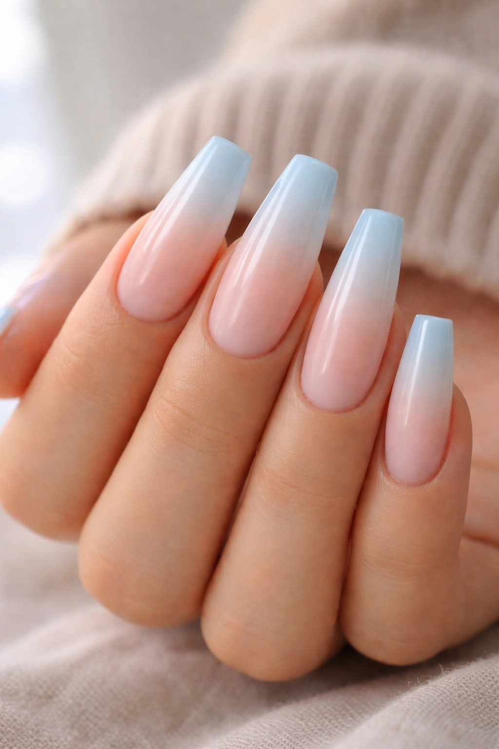 Coffin nails with nude base and sky blue gradient tip