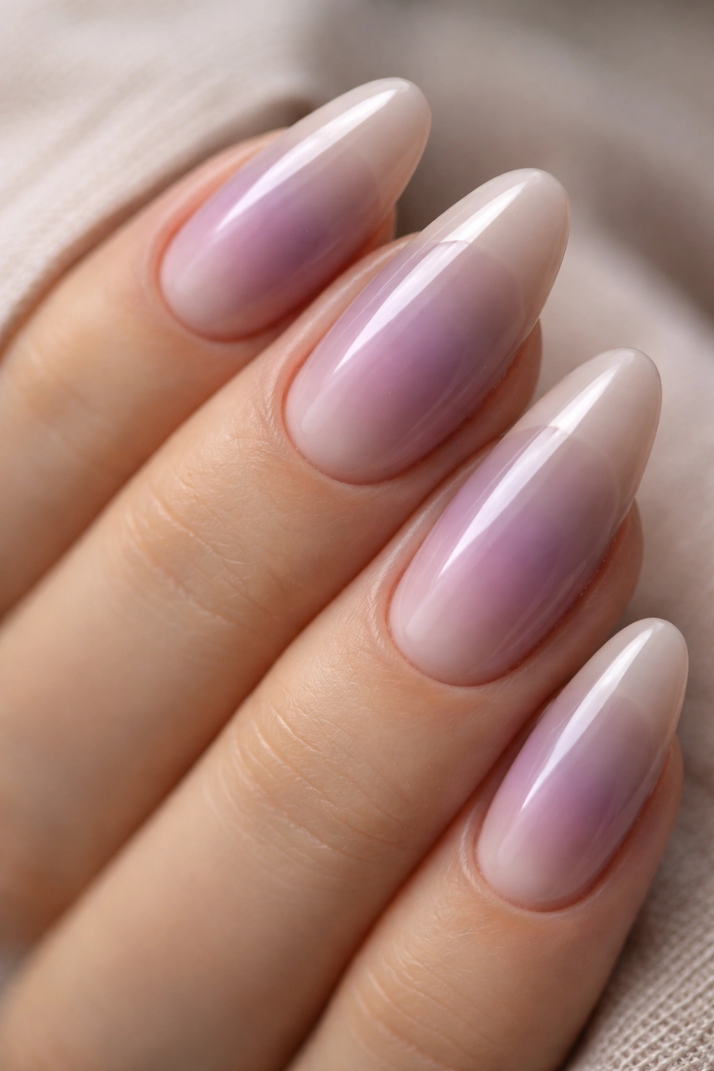Almond nails showing smoky mauve bloom with mauve center fading to taupe border