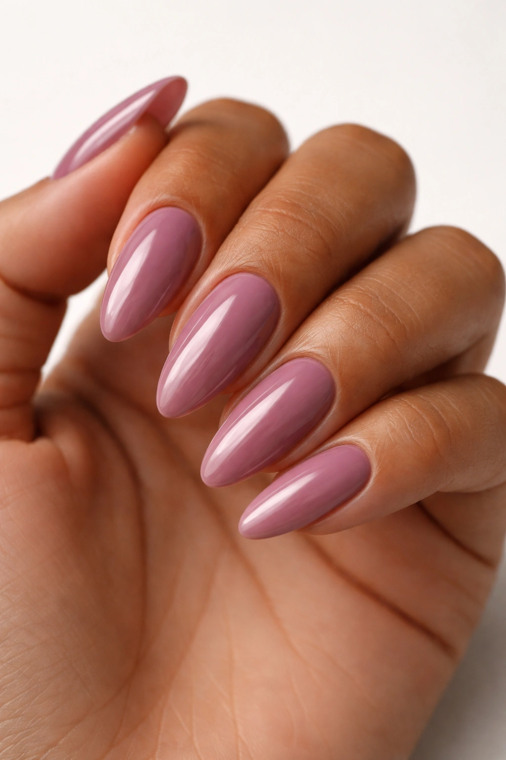 Almond nails in smoky mauve pink with glossy finish