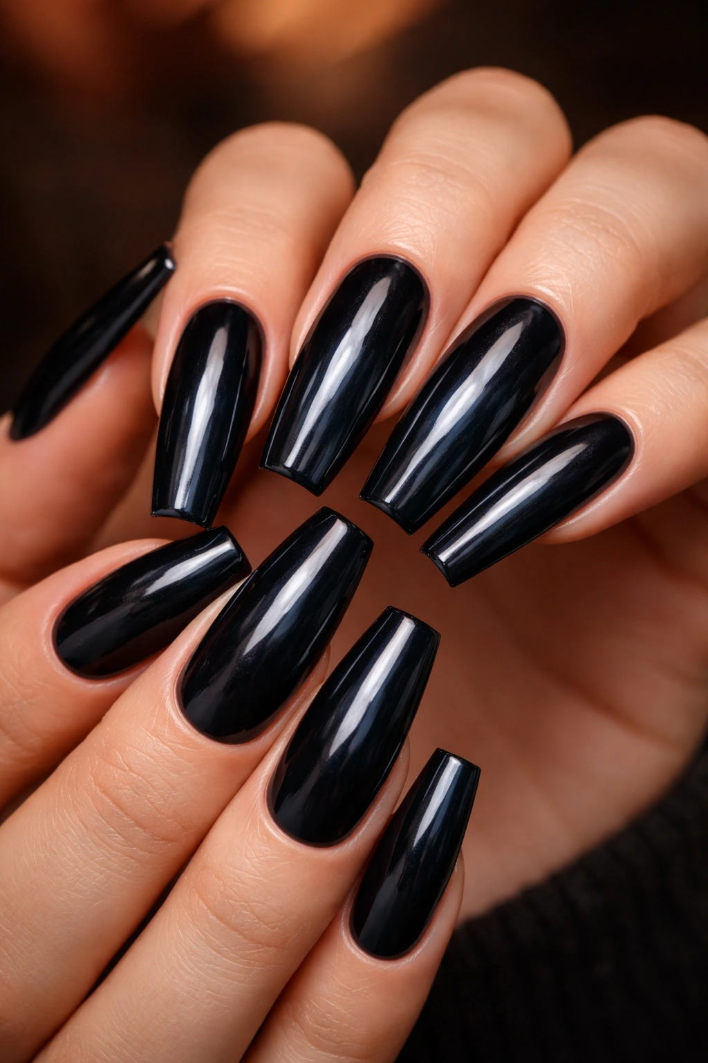 Close-up of coffin nails in smoky navy blue-black shade