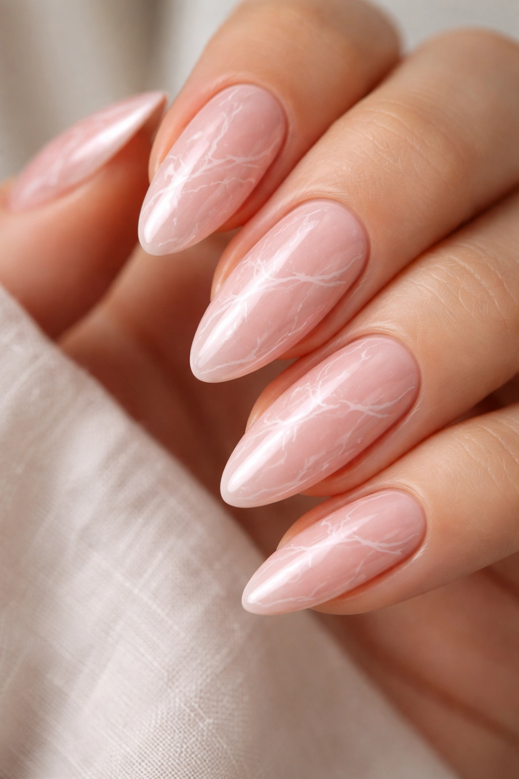 Almond nails with soft pink marble veining and pink chrome