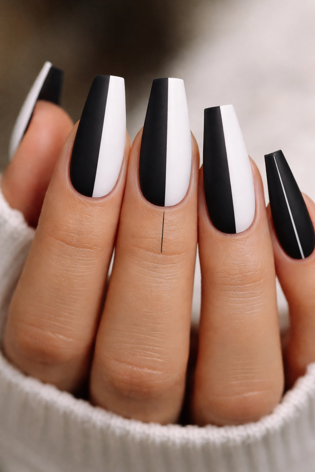 Coffin nails with centered black-and-white split and tiny gap.
