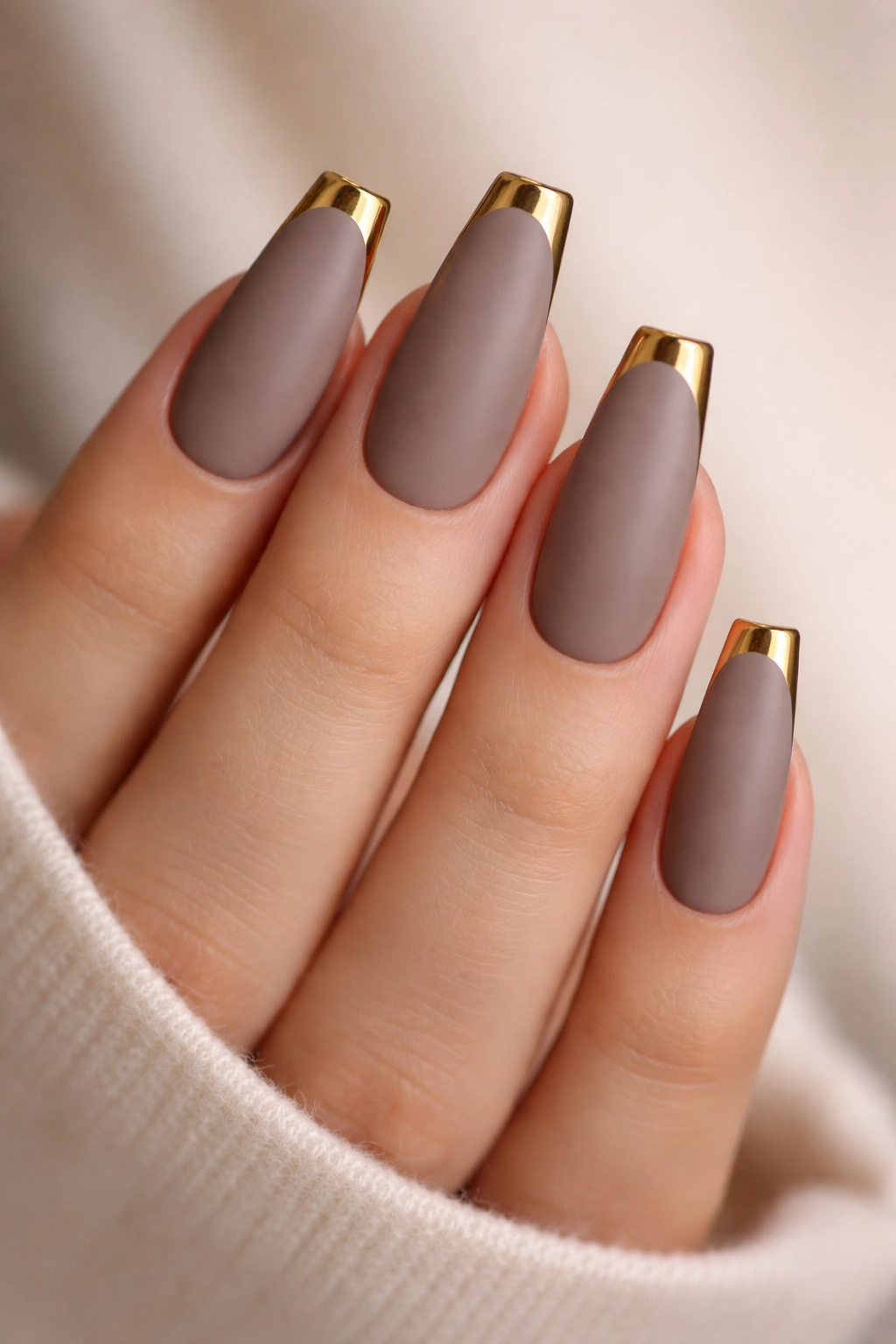 Matte taupe coffin nails with glossy gold tips