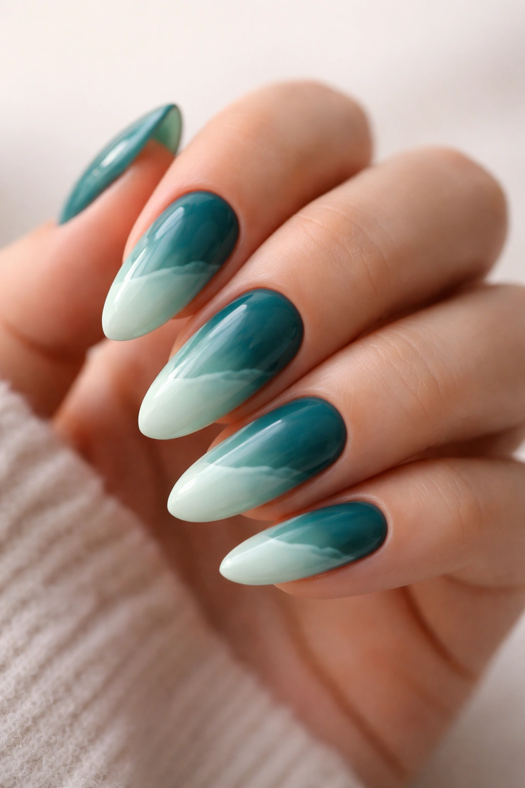 Almond nails teal to seafoam ombre with wave transition