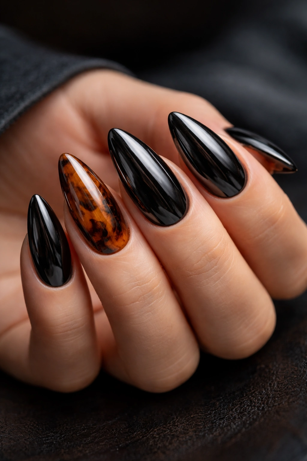 Almond nails in tortoiseshell and black chrome blend