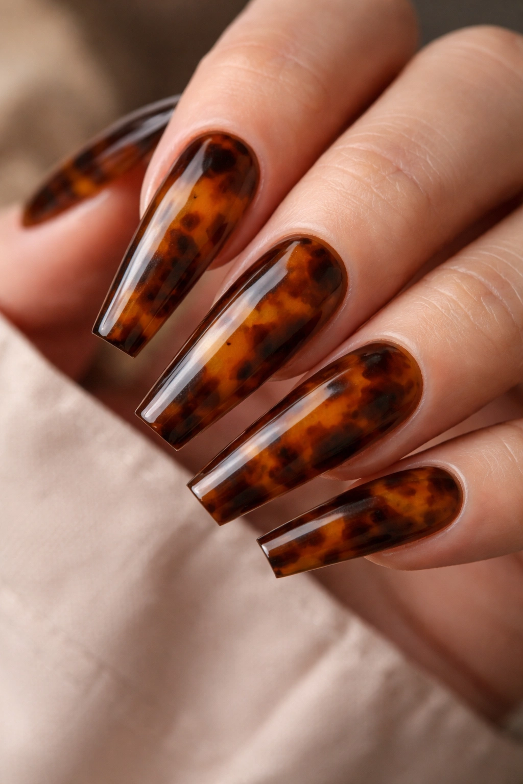 Close-up of tortoiseshell coffin nails with amber depth