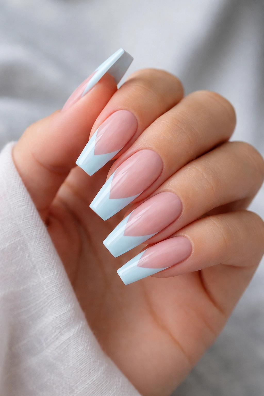 Close-up of coffin nails with a pale blue V-cut forming a sharp point.