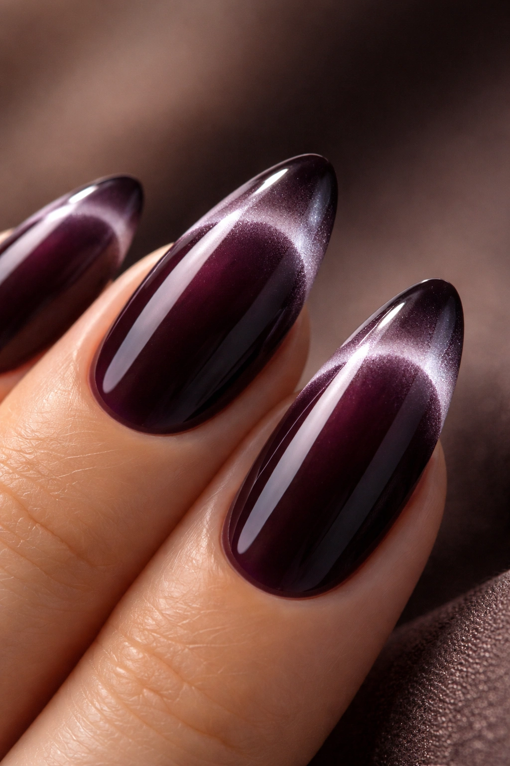 Almond nail with velvet cat-eye French tip in deep plum