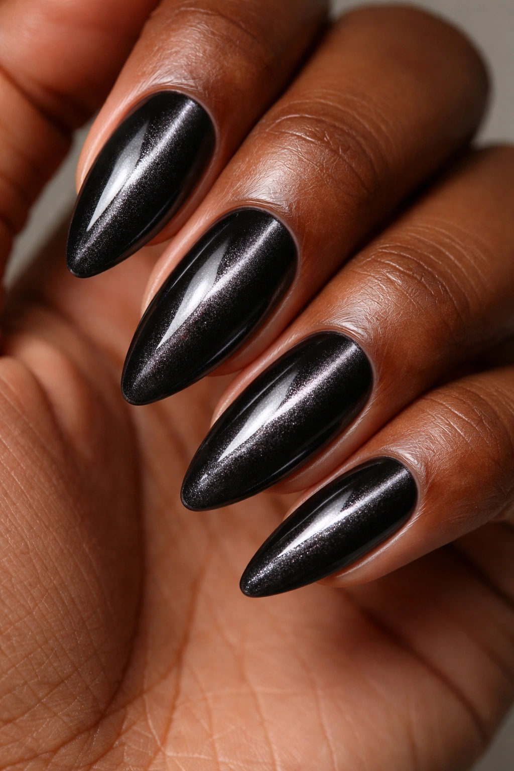Velvet cat-eye nails on almond shape with center band