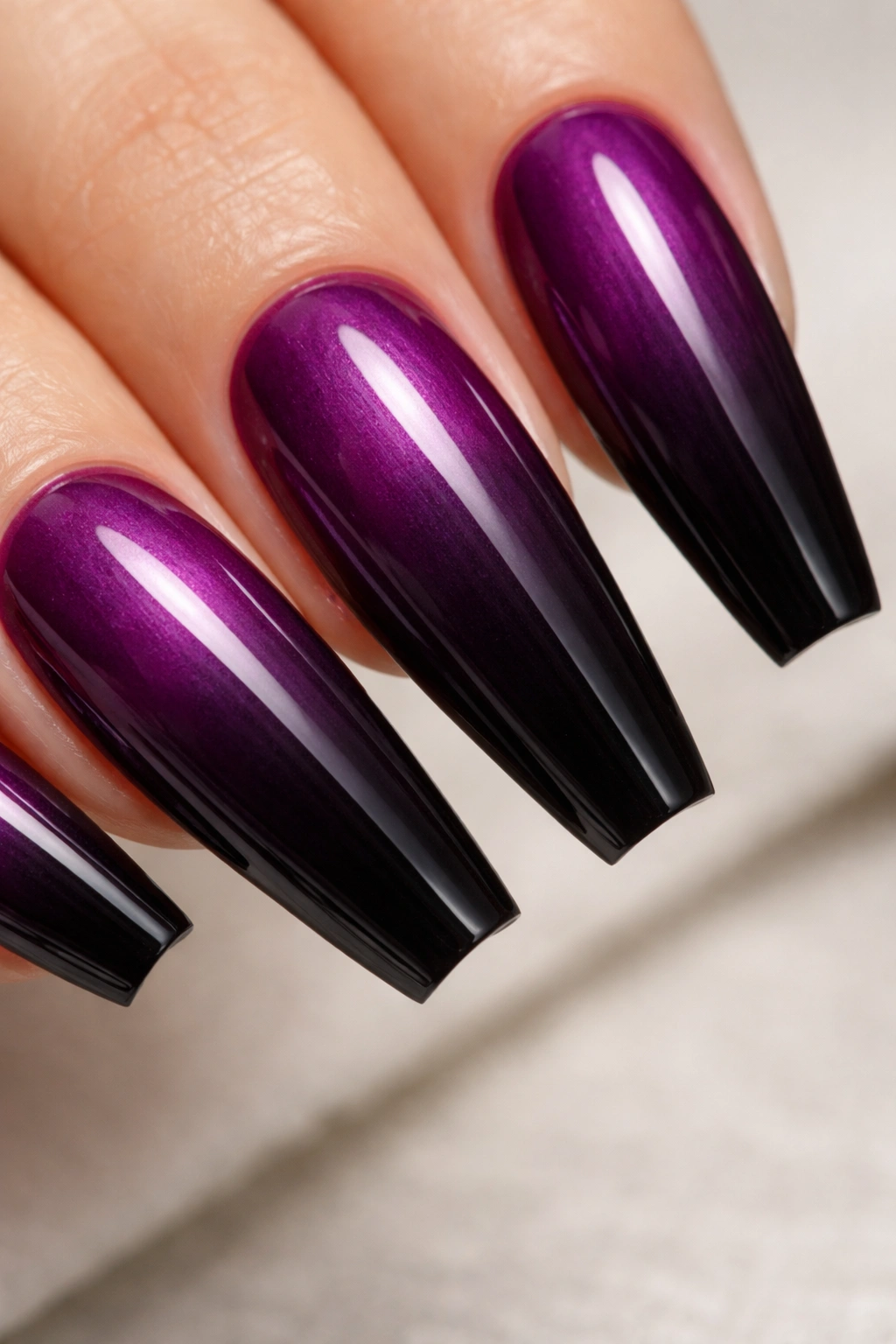 Deep violet to black ombré on a ballerina nail with glossy finish