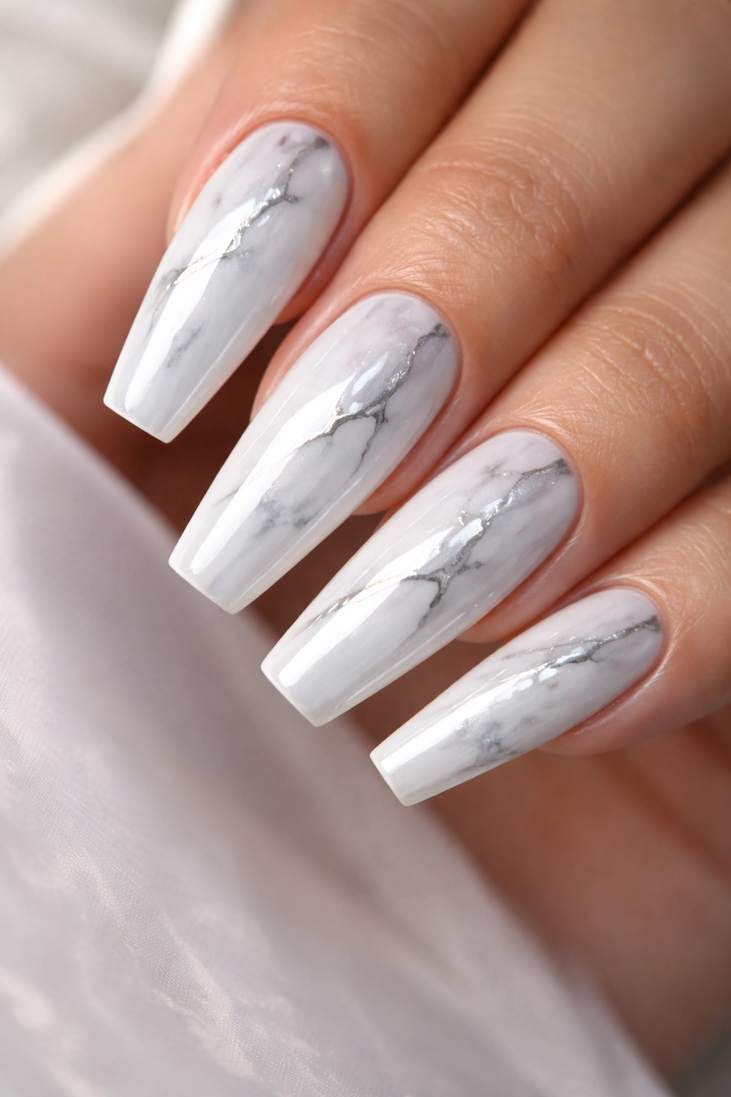 White chrome coffin nails with glassy marble veins