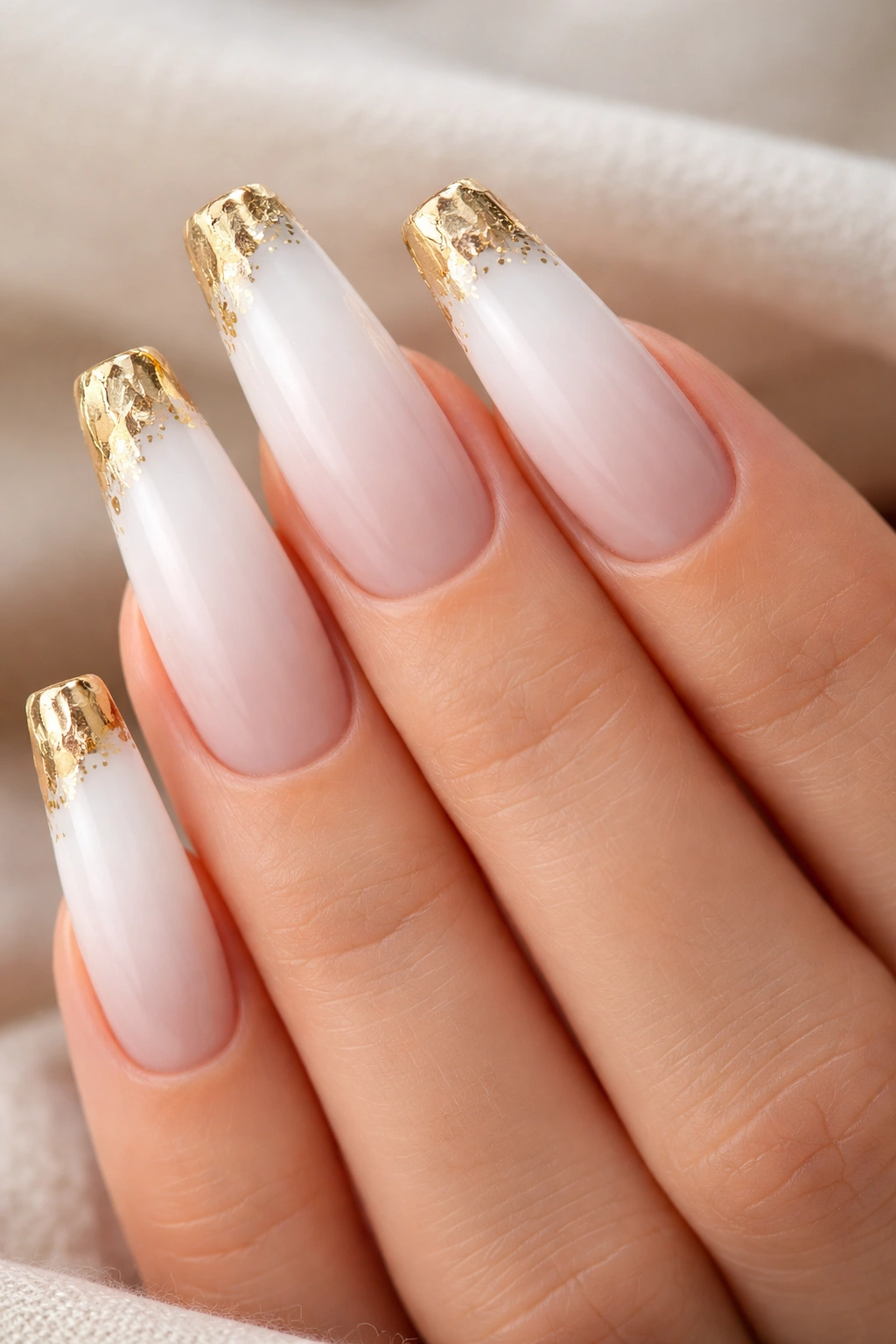 White ombre coffin nails with cracked gold foil tips