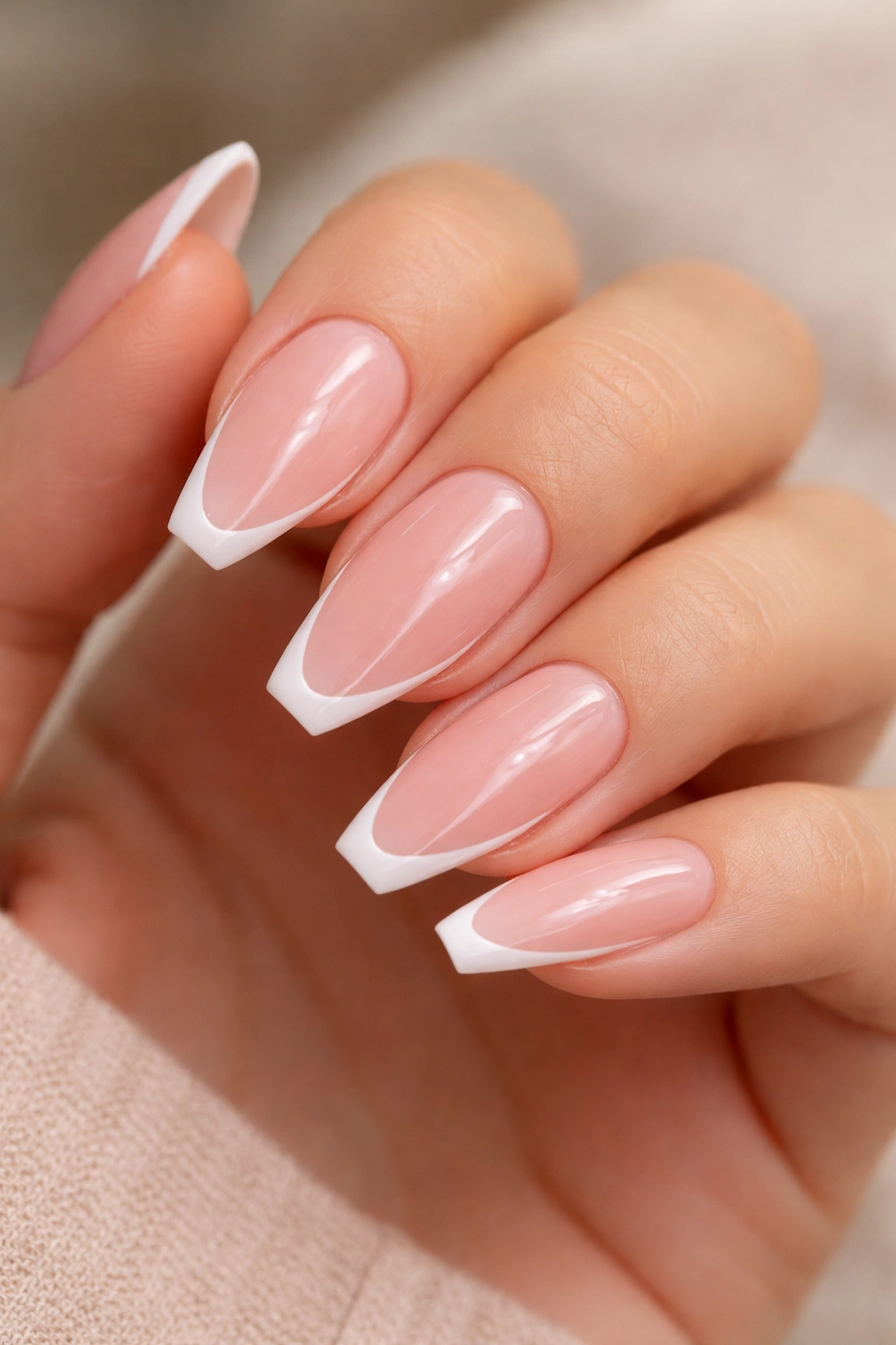 Translucent pink nails with a thin white outline at the tips