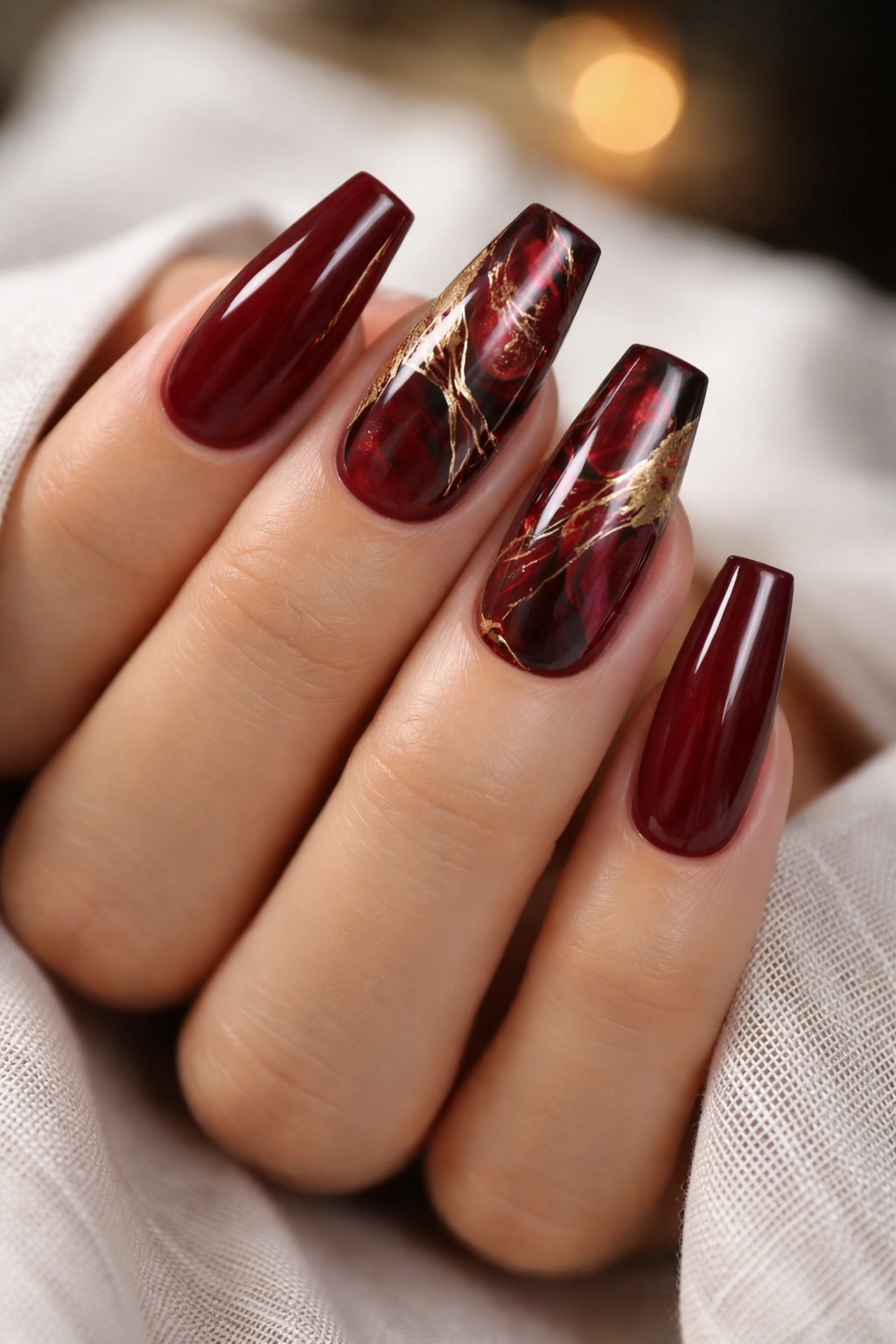 Wine red marble coffin nails with gold threads, photorealistic
