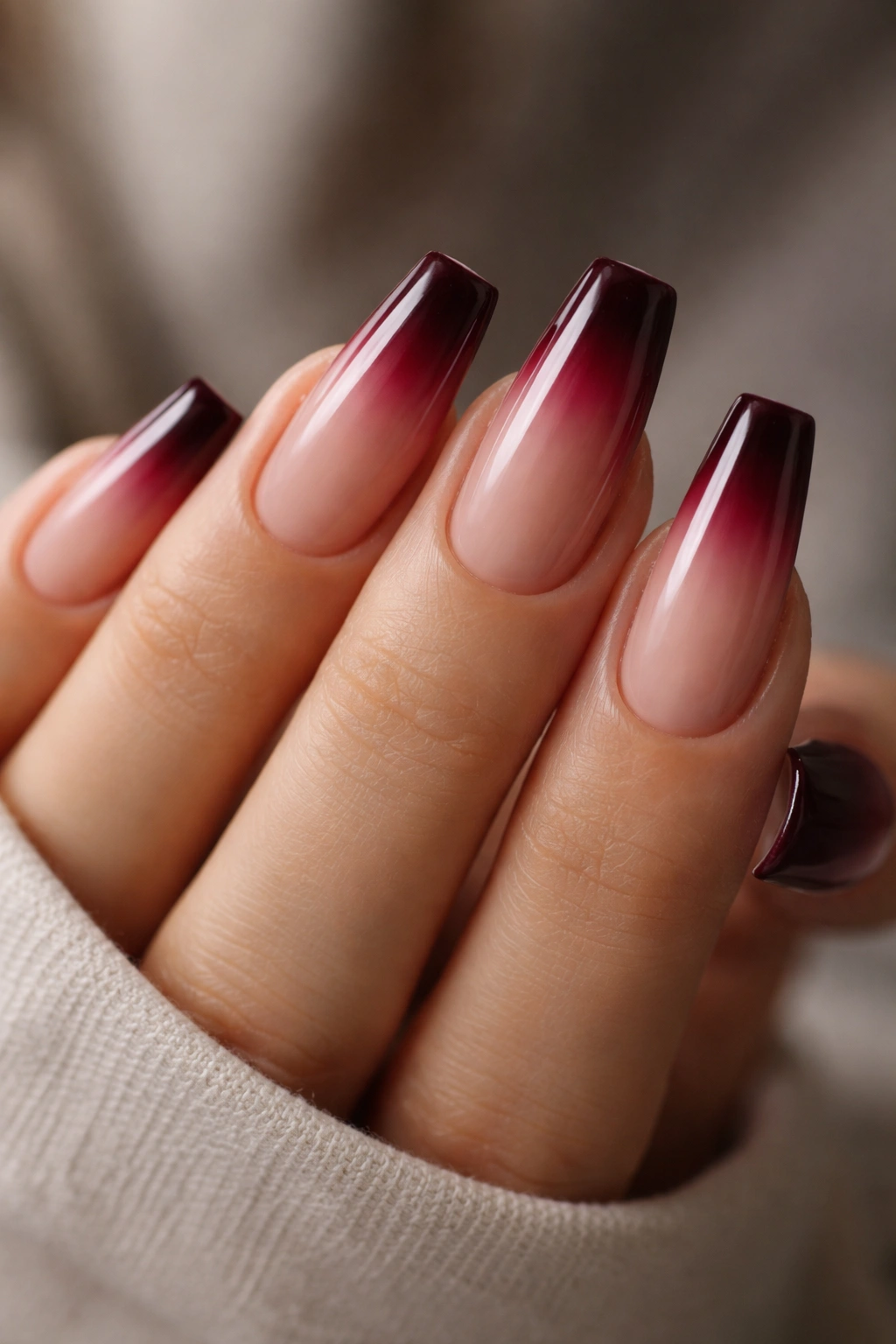 Coffin nails with burgundy tips fading into nude base