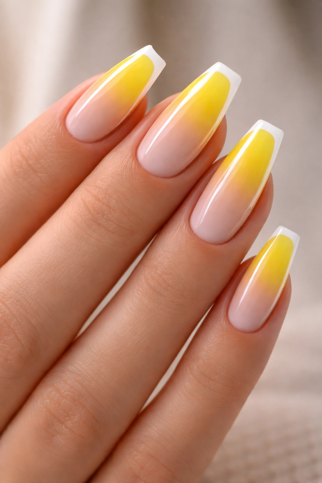 Yellow French ombre nails with a white outline