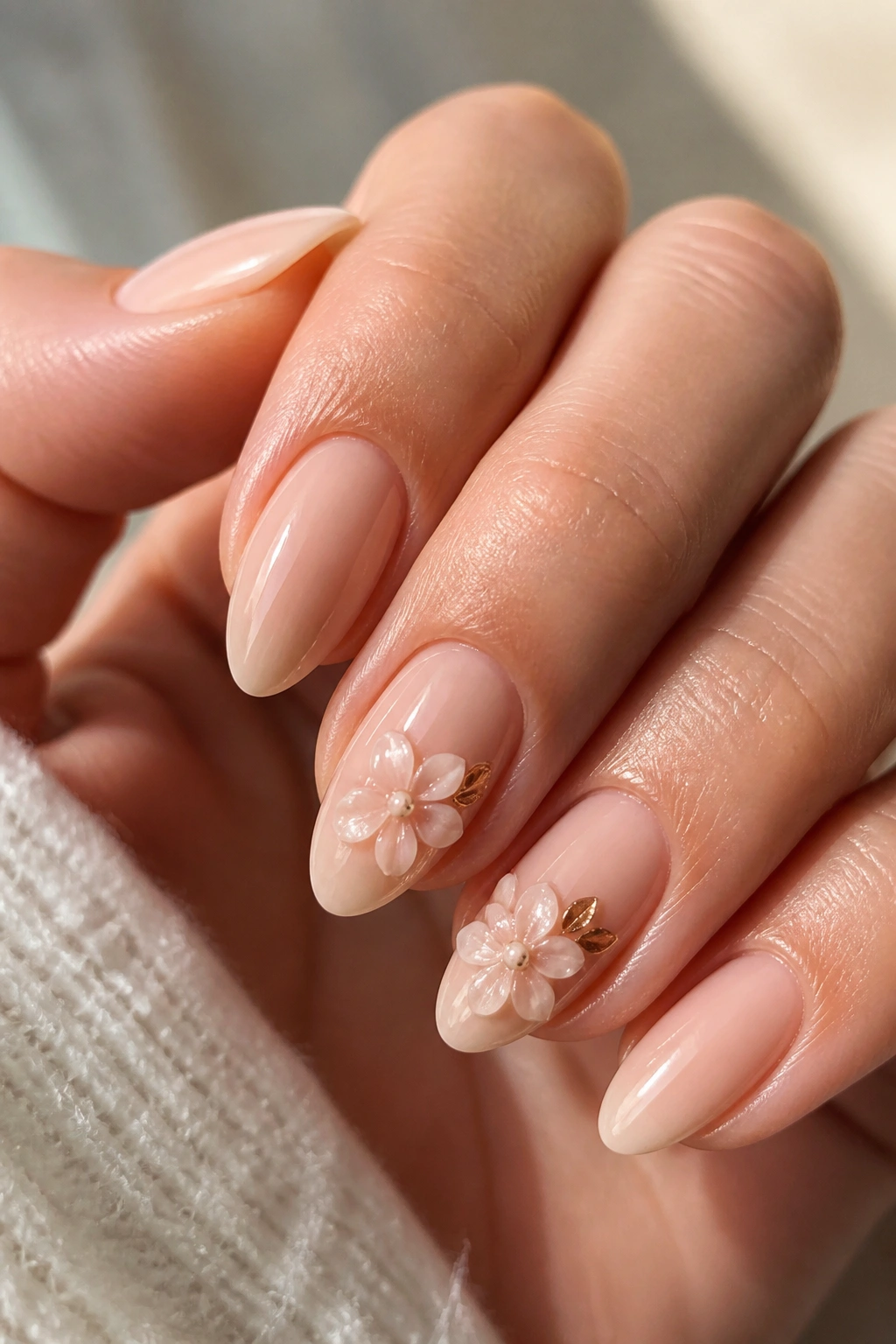 Almond nails with raised gel flowers on top