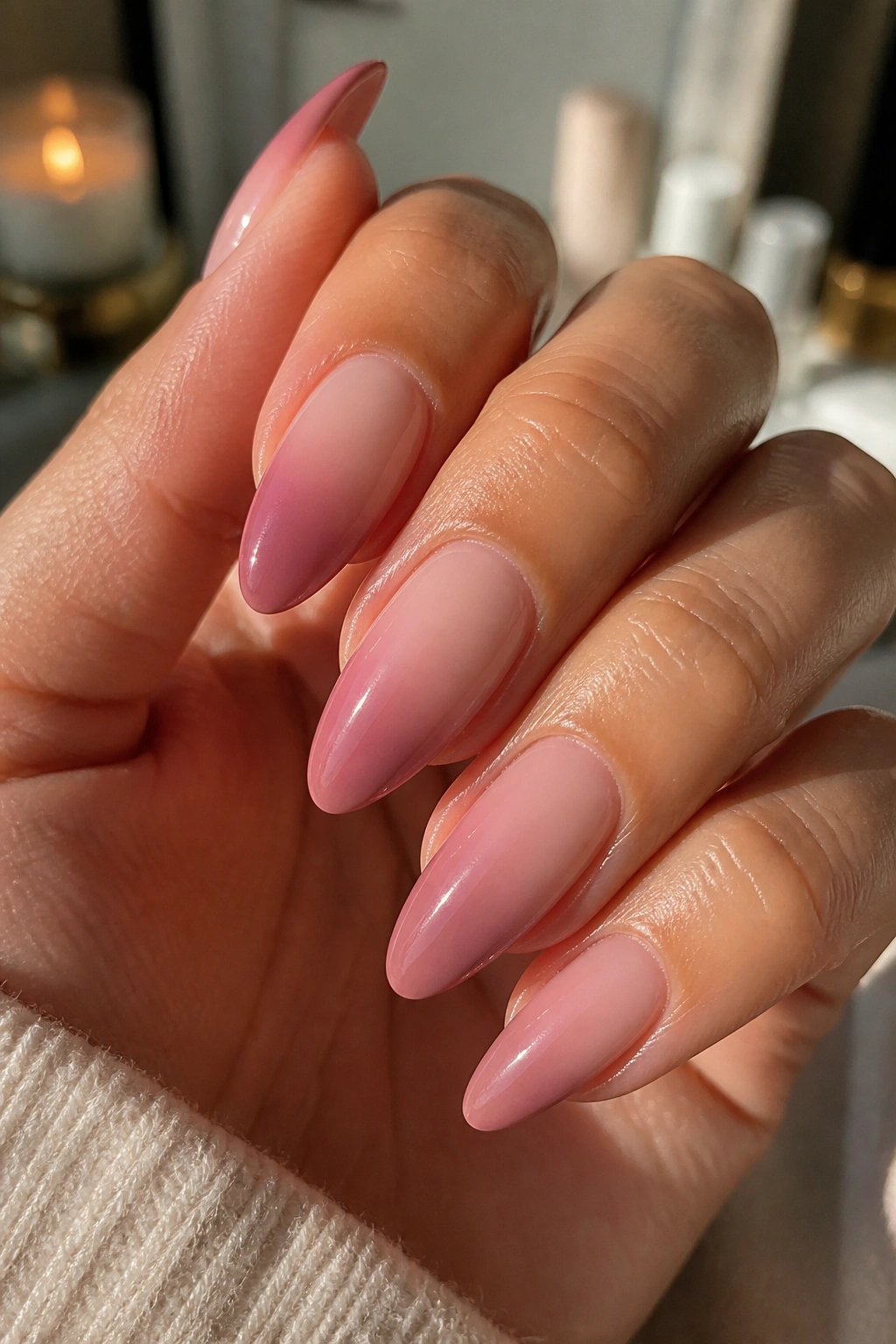 Close-up of almond nails with a base-to-tip ombre gradient aligned to undertone