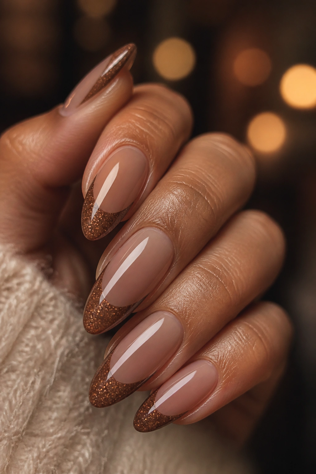 Almond nails with amber glitter brown tips on mocha base
