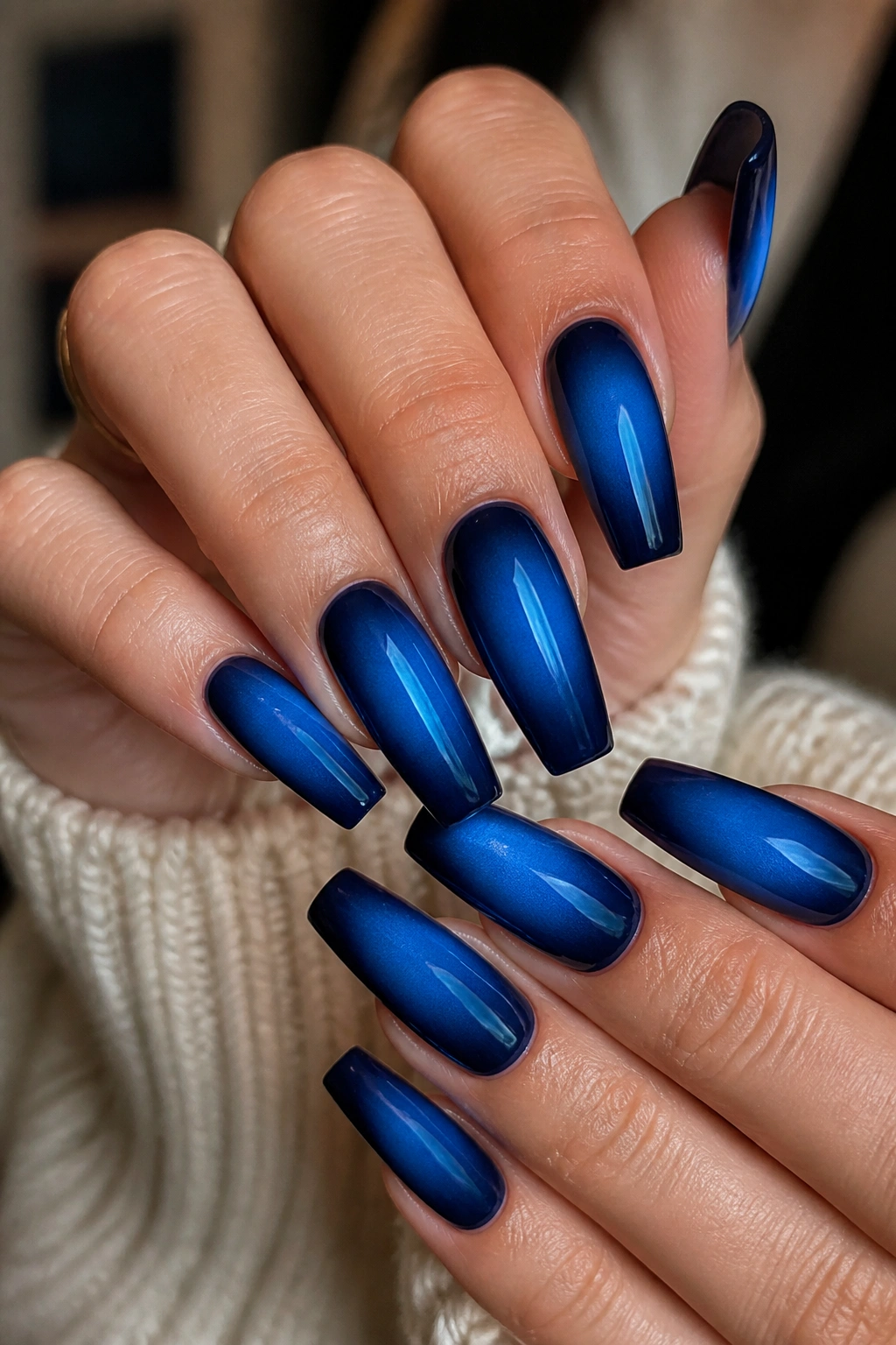 Dark blue aura coffin nails with center glow on real hands