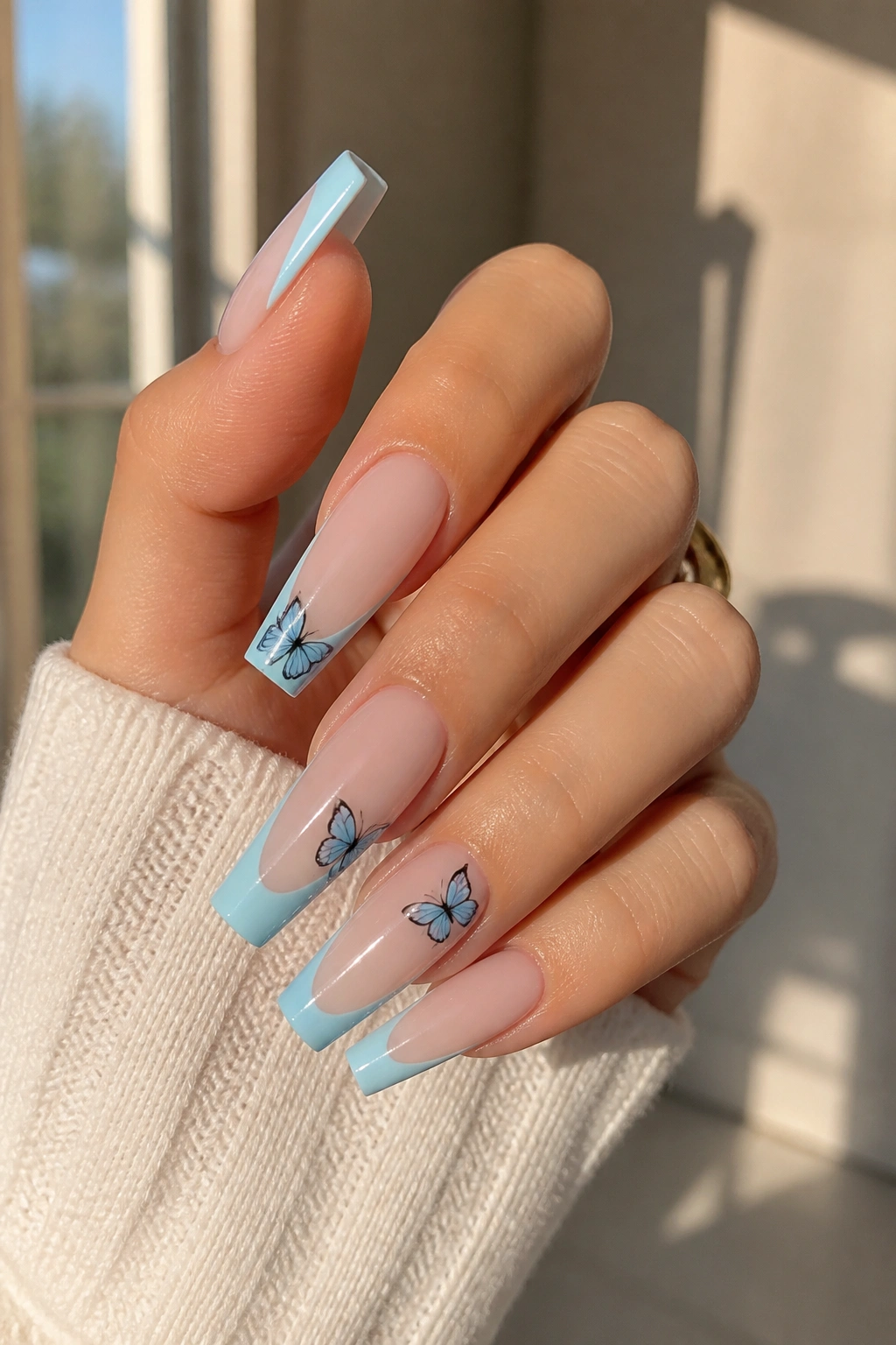 Baby blue butterfly French coffin nails on real hand