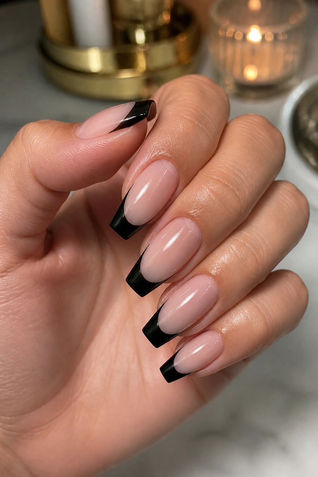 Coffin nails with nude base and black French tips