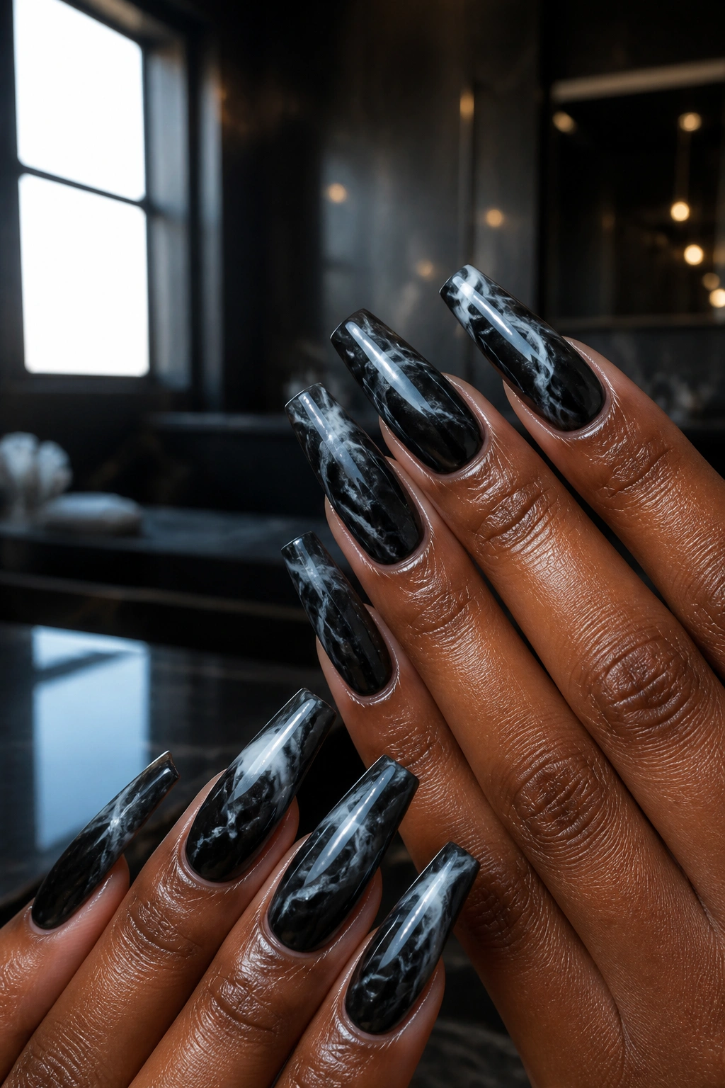 Black marble coffin nails with smoke-white swirls on real hands