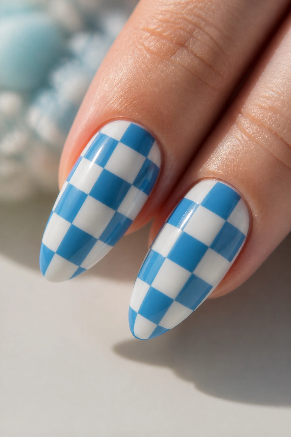 Almond nails with blue and white checkered pattern