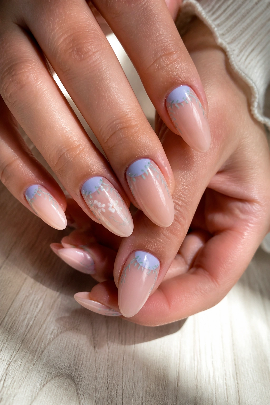 Almond nails with bluebell reverse French and tiny vines on a real hand