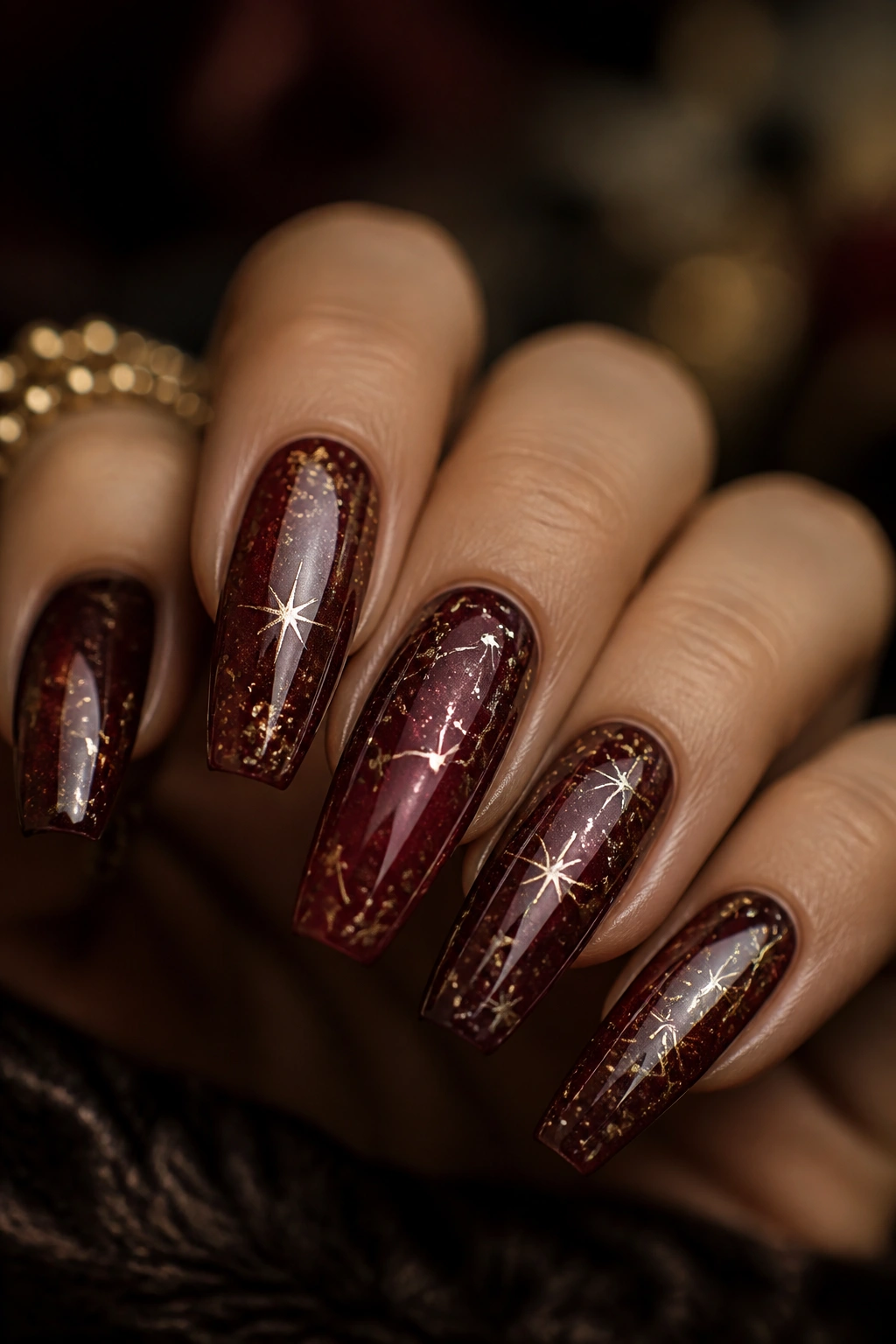 Burgundy coffin nails with bronze celestial details