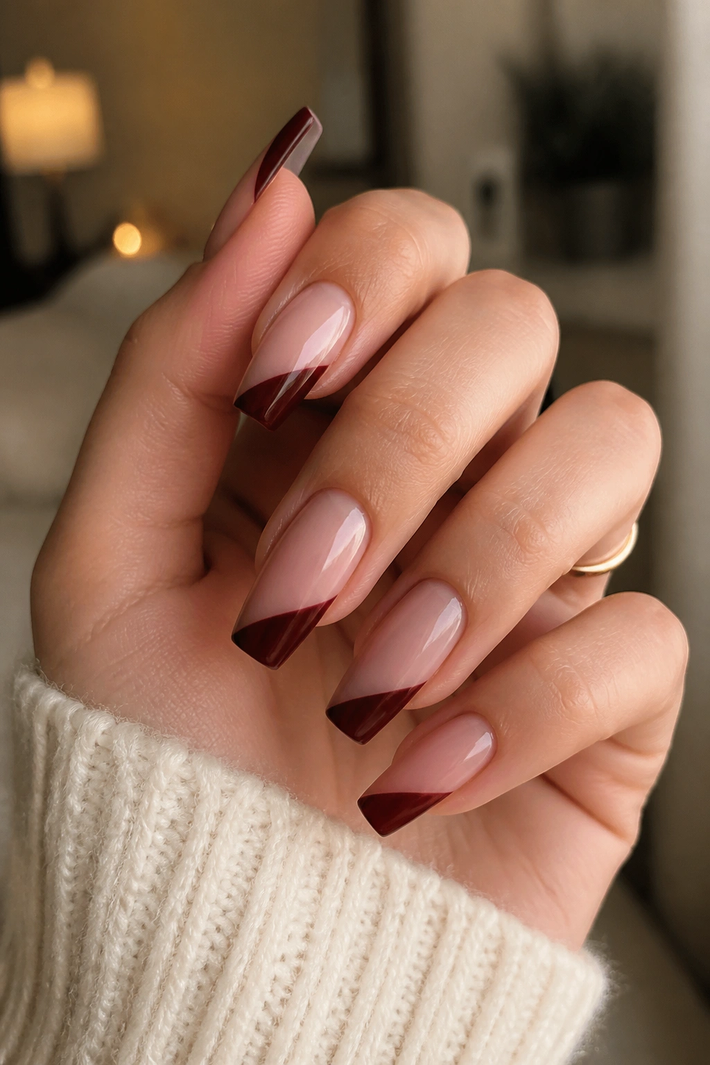 Close-up of coffin nails with diagonal burgundy side-swept tips