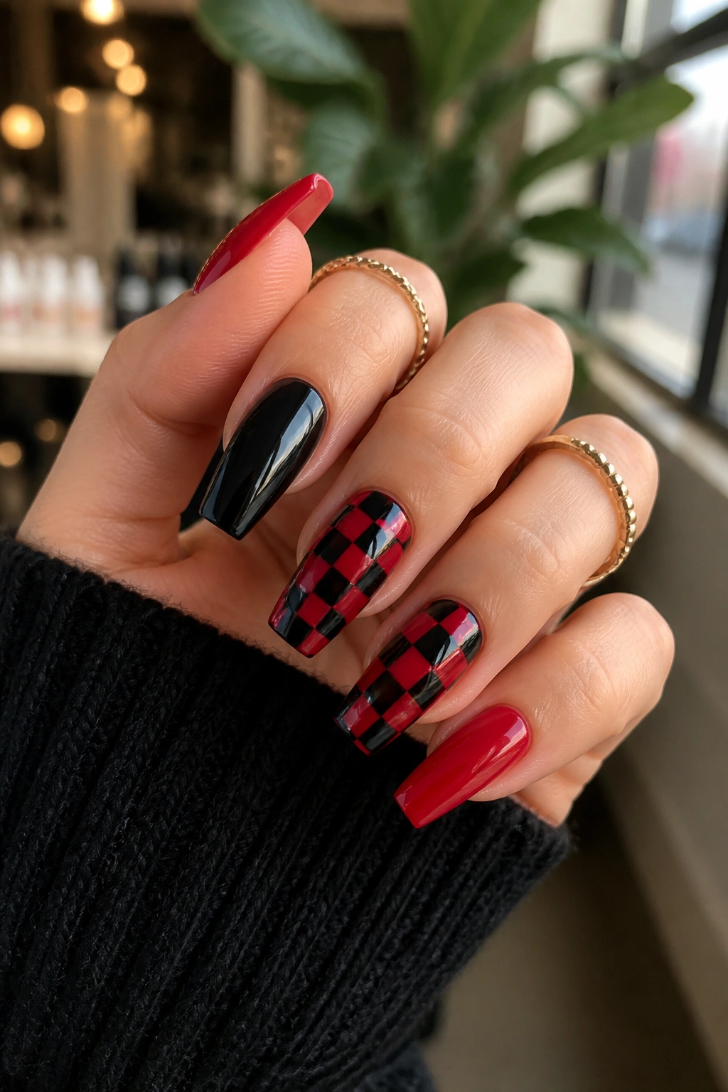 Checkerboard red and black coffin nails on real hand