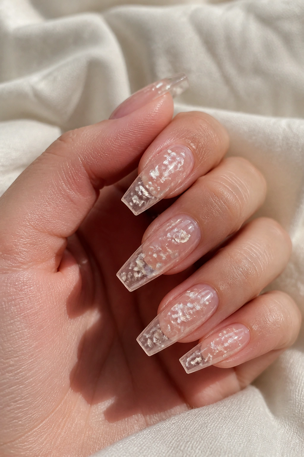 Clear nude coffin nails with suspended pearl flakes