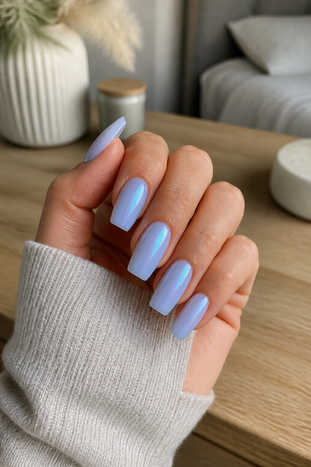 Close-up of cloud blue aura ombre nails with iridescent center