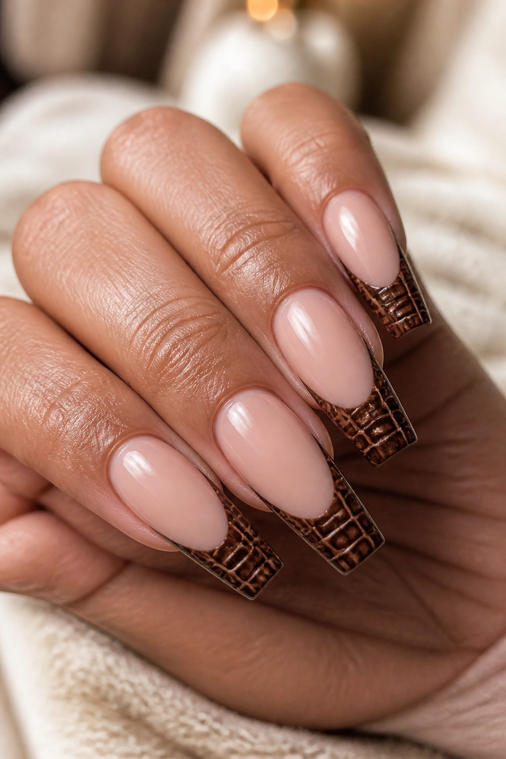 Close-up of croc-textured burnt cocoa brown French tips on coffin nails