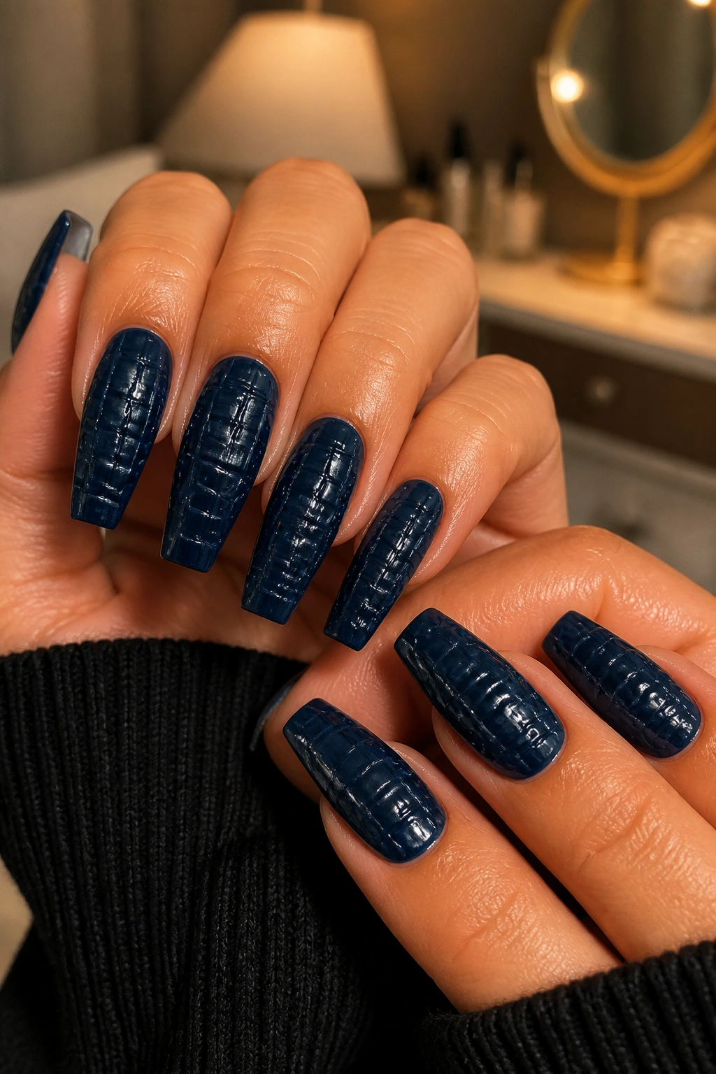 Close-up of croc-textured midnight navy coffin nails on a real hand